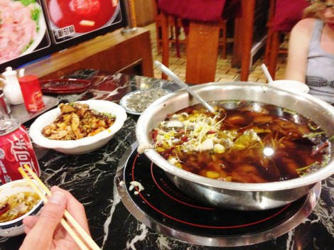 Hot pot with a whole fish thrown in: scales, head, eyes, and all.