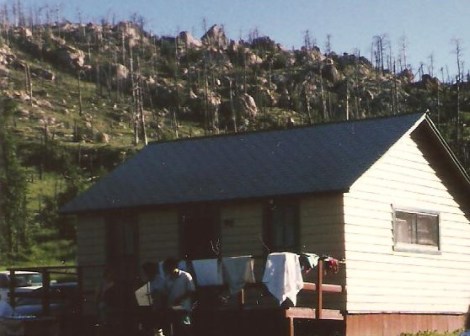 I don't have a picture of our mobile home. This was one of the other cabins set against 'Tick Mountain.'
