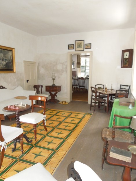 Parlor/game room with flooring that was a precursor to linoleum